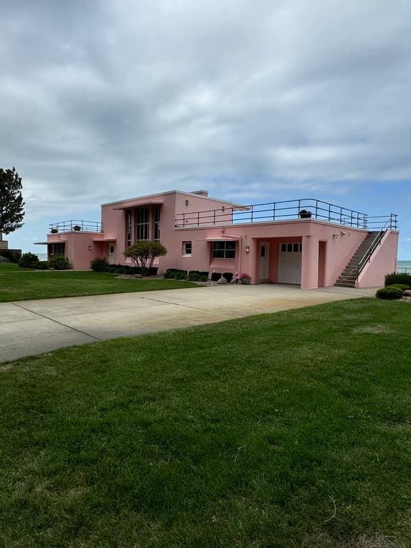 a salmon colored historical home in indiana dunes park
