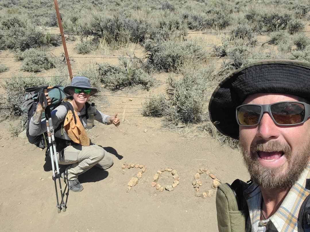 Mackenzie Fresquez and friend with rocks saying 700
