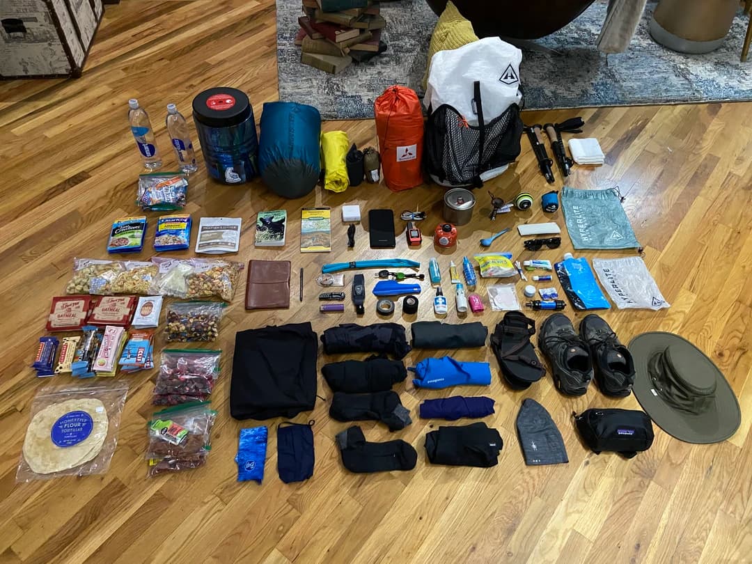 a collection of gear for a backpacking pack